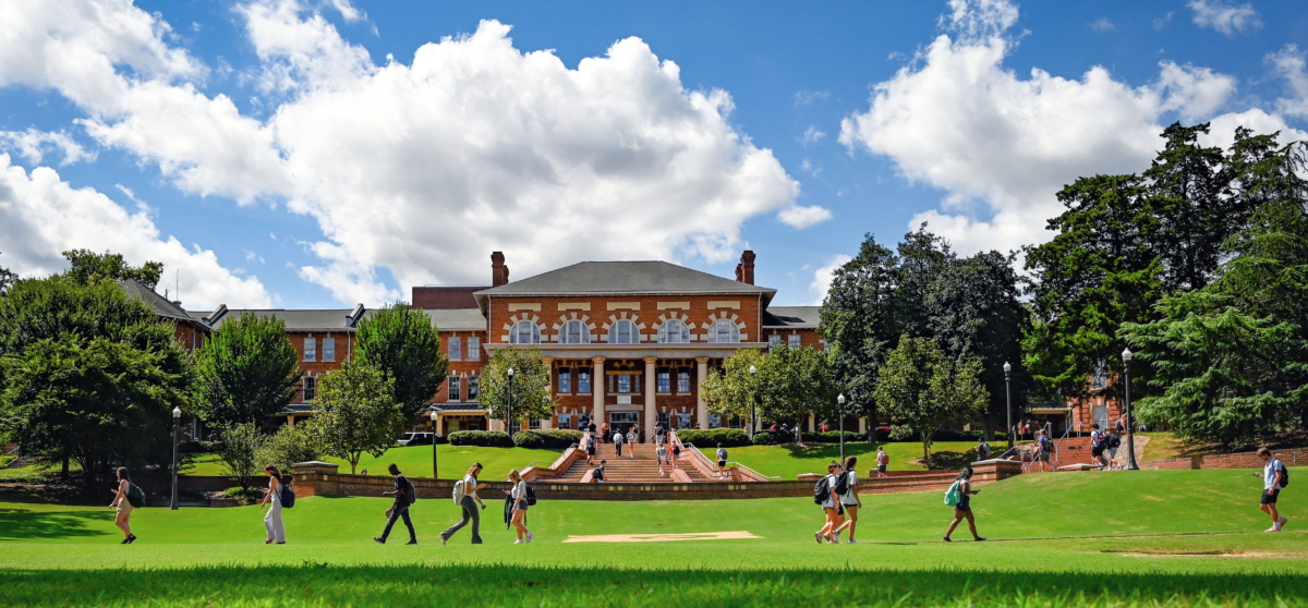 Students make their way to class early in the 2022 fall semester across the Court of North Carolina, with the 1911 Building as a backdrop. Photo by Becky Kirkland.
