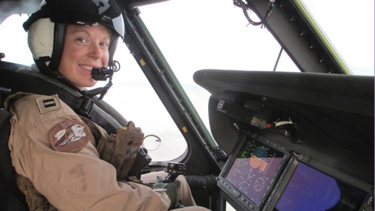 Mary Hesler, an active-duty service member and NC State Engineering Online student, sits in a helicopter.