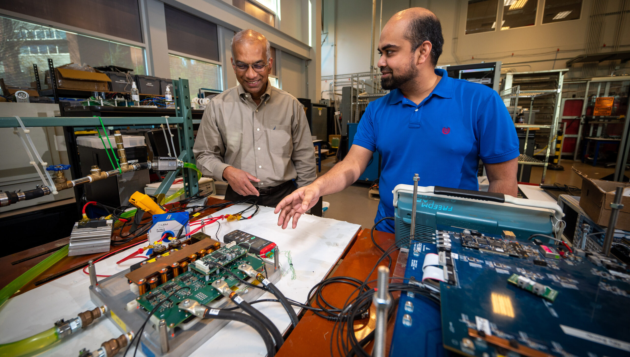 lqbal Husain works with a graduate student inside of the FREEDM Center on Centennial campus.